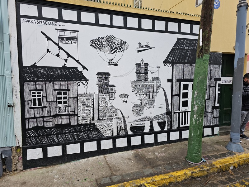 A piece of black and white street art piece in Valparaiso