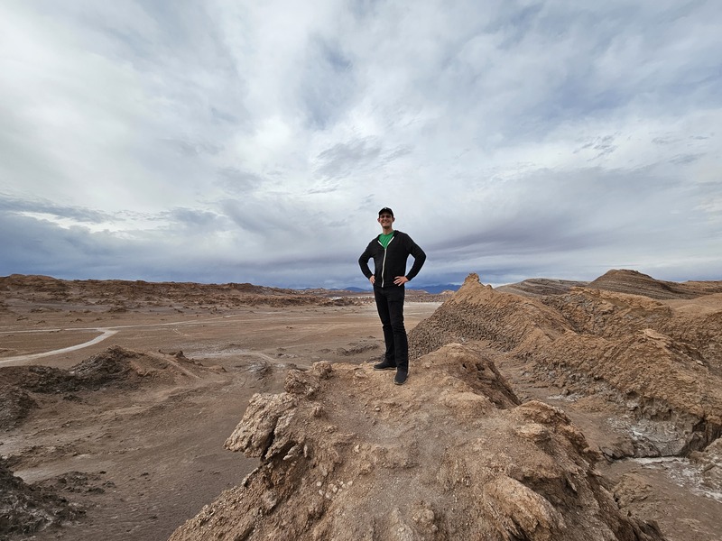 Standing on a rock with a view of the Atacama desert