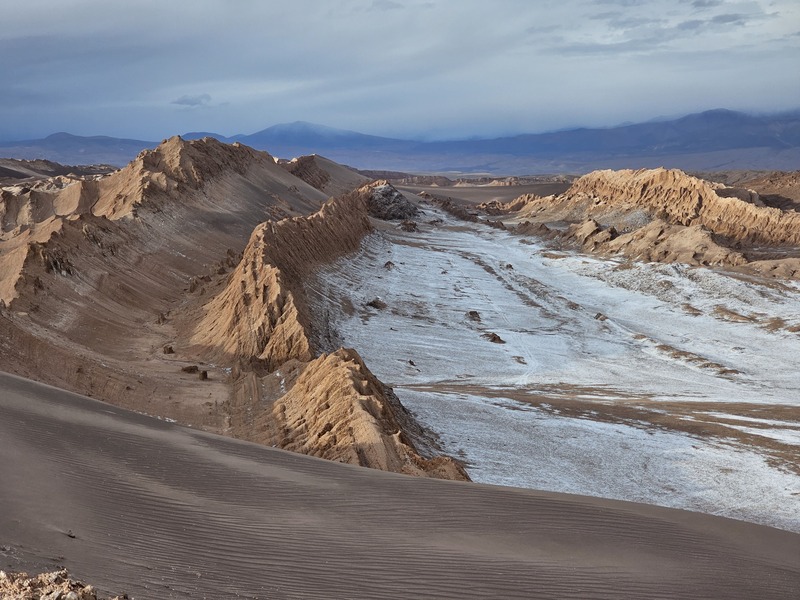 A view of a valley with a white salt floor