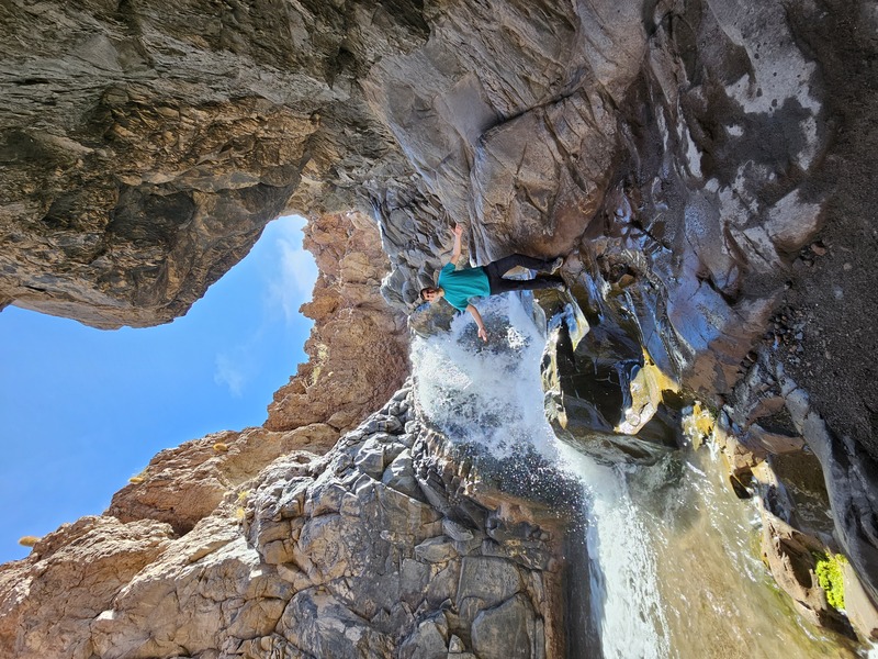 Standing on rocks clambering down the canyon