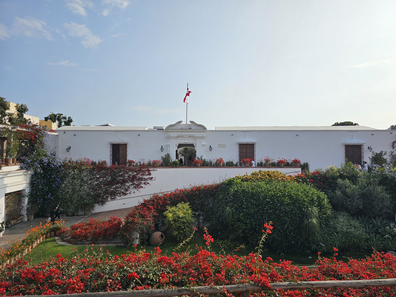 The Museo Larco exterior and flower-filled courtyard