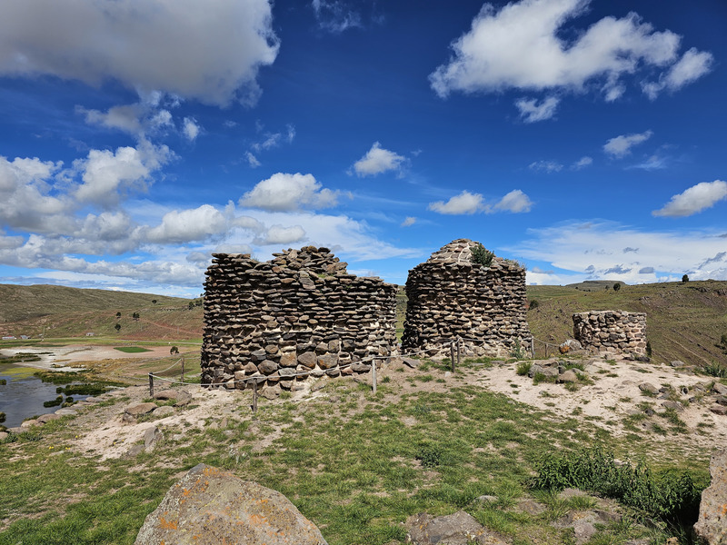 A set of older Sillustani burial towers with smaller rocks mortared together