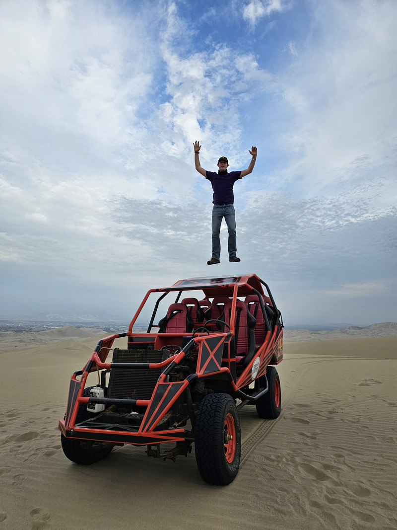 Jumping on the roof of a dune buggy at Huacachina