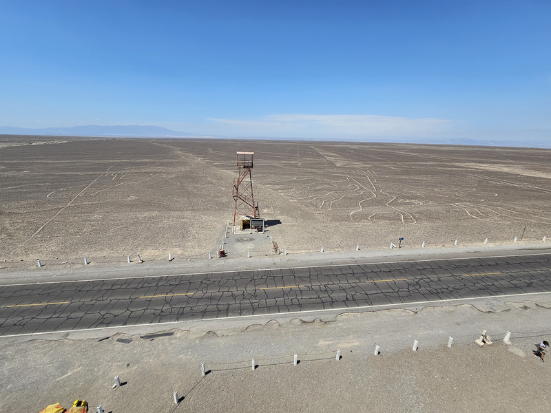 The old nazca lines tower above a figure