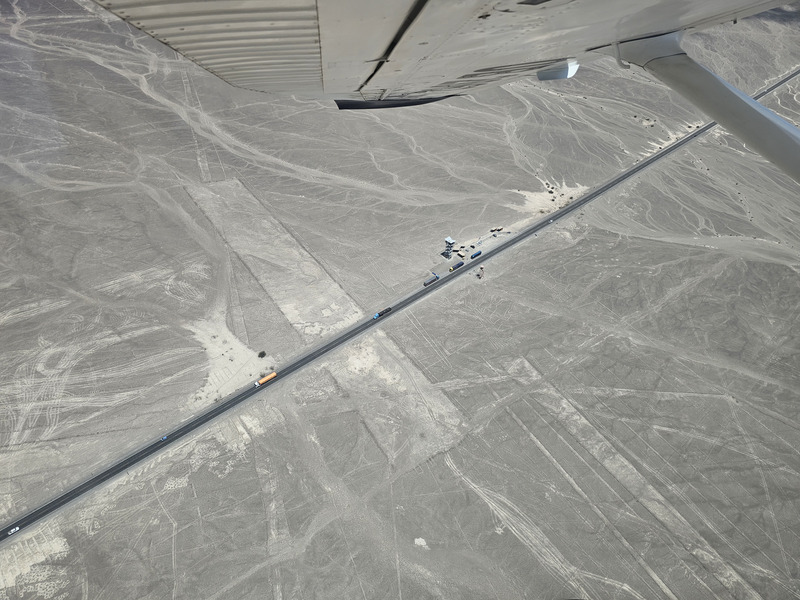 The Nazca lines towers, viewed from the air, with a wing in frame for scale