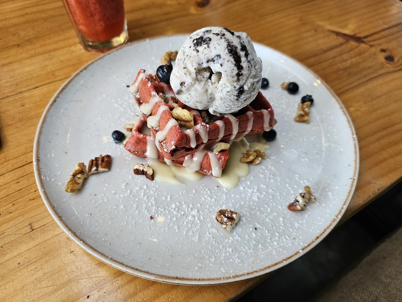 A red velvet waffle with ice cream