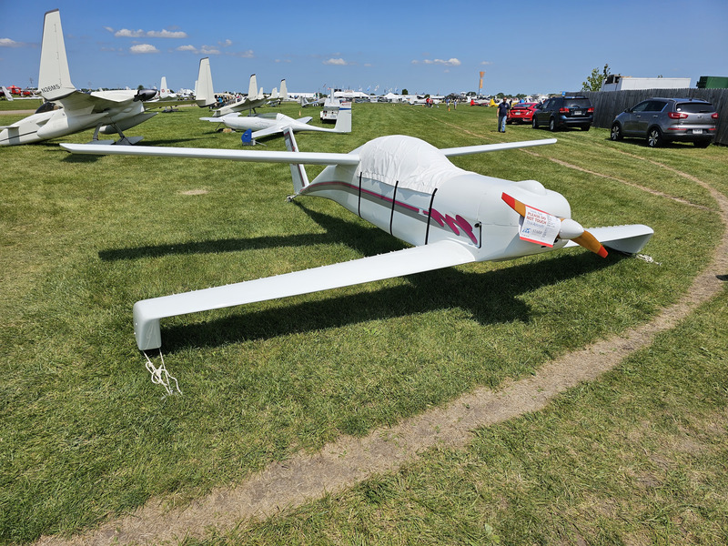 A plane with wings at the nose and tail, but none in between