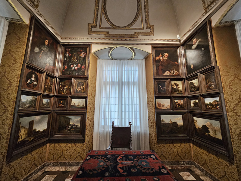 Wawel Royal Castle interior with paintings and a desk